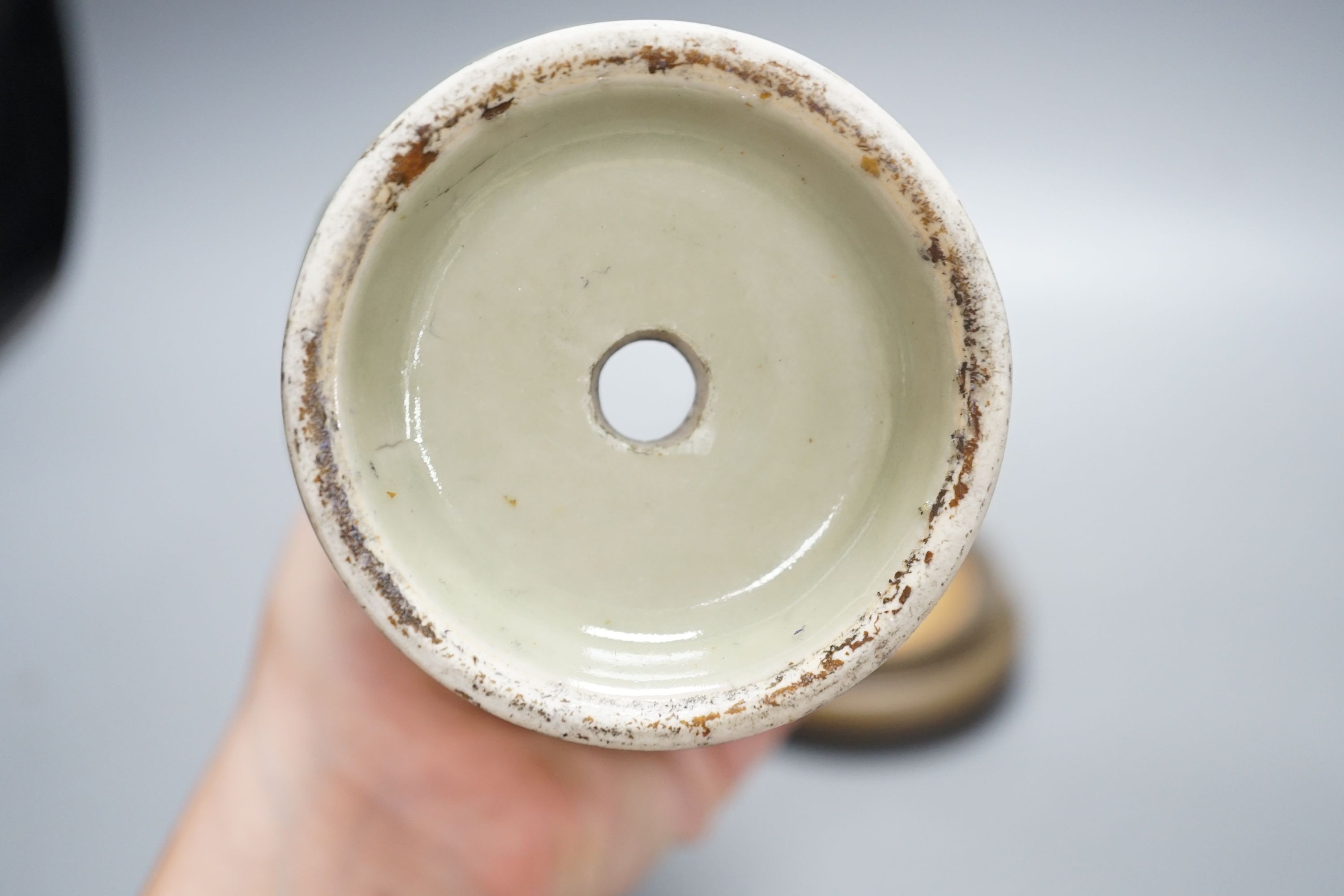 A Chinese celadon vase on stand, 24 cms high including stand.